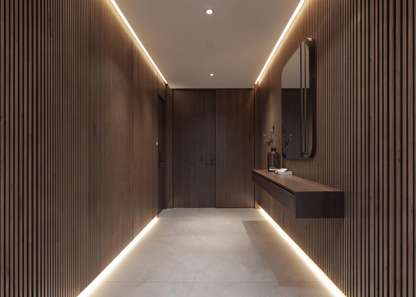 Hallway with fluted wood panels and a continuous LED light line along the floor