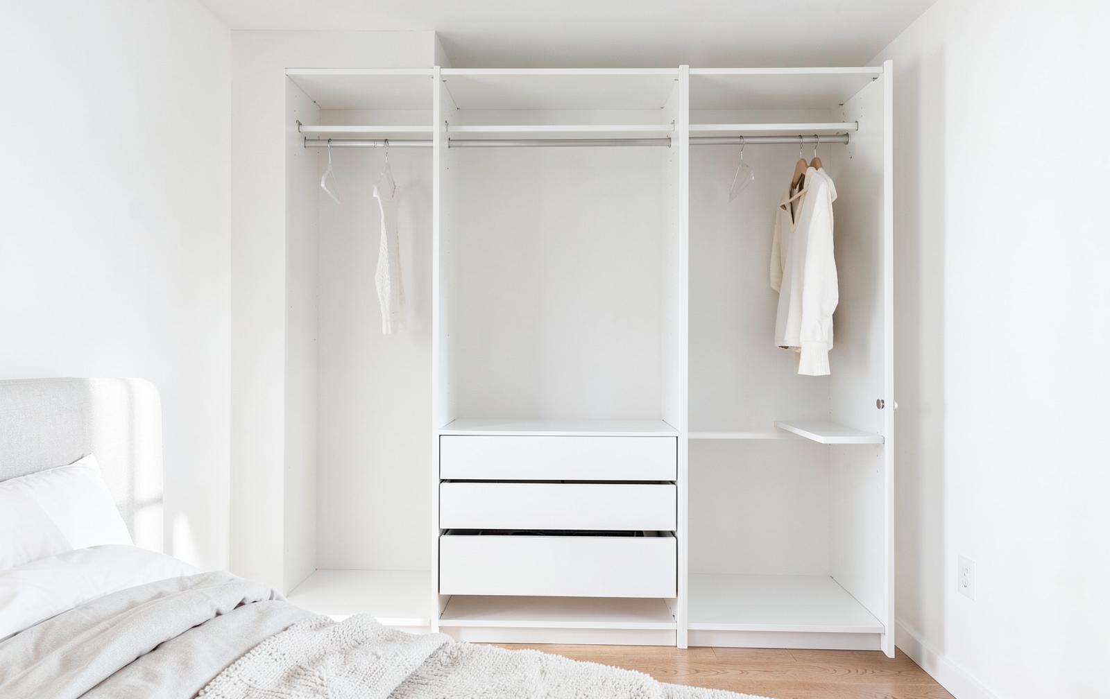 Simple custom reach-in closet with shelves, rods and drawers